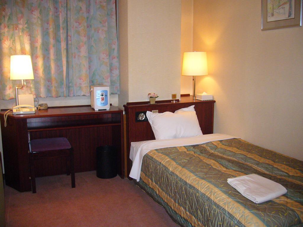 City Hotel Ikeda Okayama Værelse billede